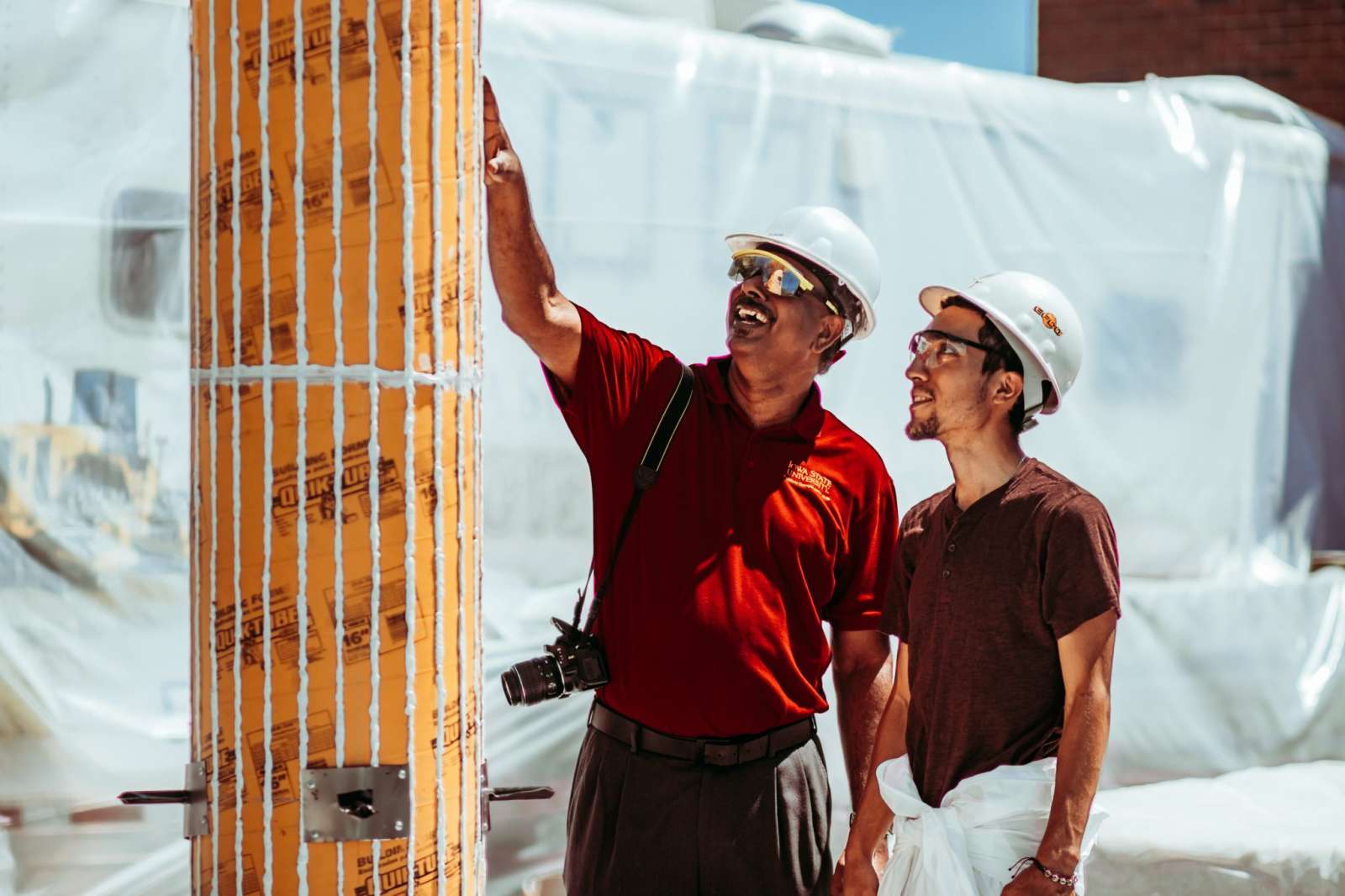 An instructor showing a student a column