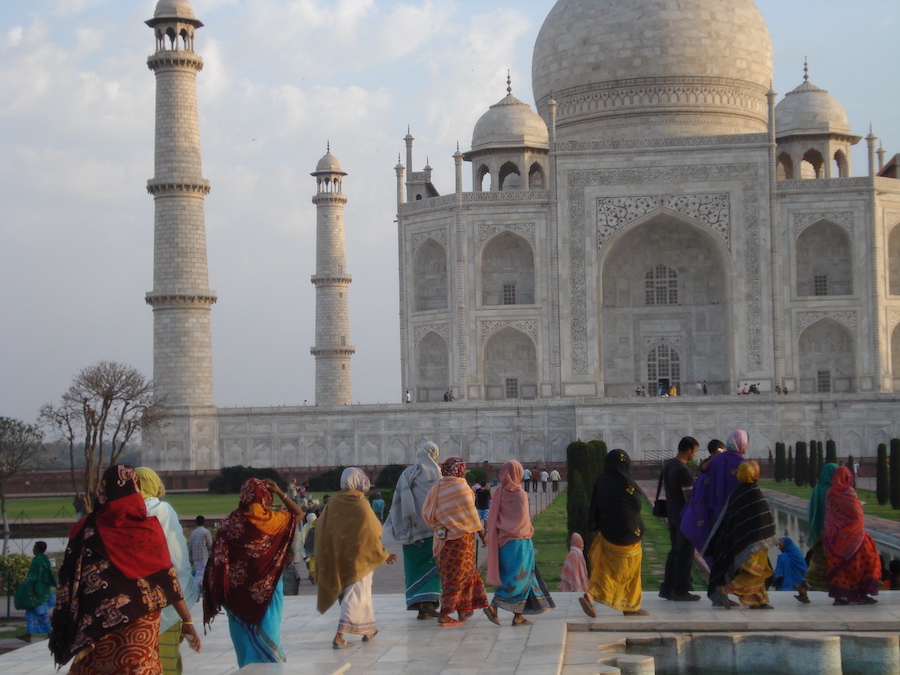 Women in colorful saris visiting the Taj Mahal