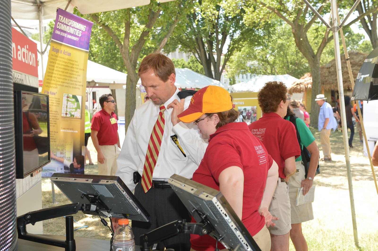 Provost Wickert looking at a display booth